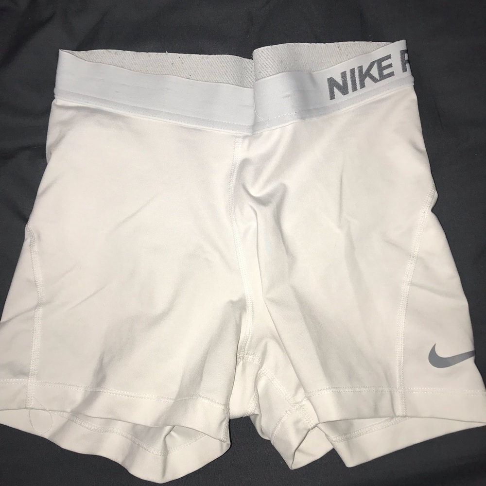 White Dri-Fit Nike shorts.